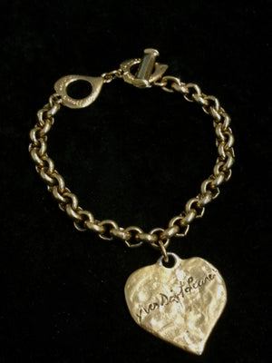 Yves Saint Laurent 1980's-1990's gold plated heart logo bracelet with pouch