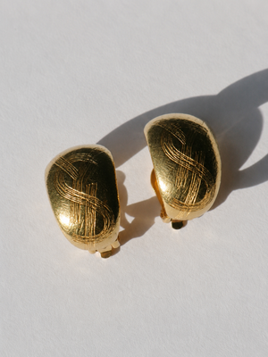 Yves Saint Laurent 1980's gold plated logo clip on earrings